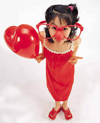 silly girl with red heart balloon